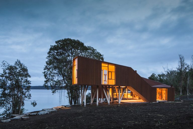 Corten Steel Family House On The Steep Bank Of A Beautiful Lake